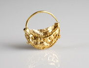 Roman/Byzantine Gold Earring
AV
0,62 g / 15 mm
~ 3rd-6th century



Austrian collection, acquired at the European art market.