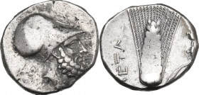 Greek Italy. Southern Lucania, Metapontum. AR Stater, c. 340-330 BC. Obv. Helmeted head of Leukippos right; AMI to left. Rev. Ear of barley with leaf ...