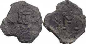 Tiberius III, Apsimar (698-705). AE Follis. Syracuse mint, 698-701. Obv. Crowned and cuirassed bust facing, holding spear and shield decorated with ho...