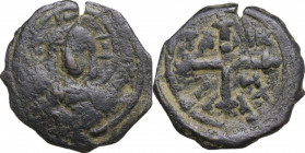 Antioch. Tancred, Regent (1101-1103, 1104-1112). AE Follis. D/ Bust of Christ, nimbate, wearing tunic and cloak, holding Gospels. R/ Ornate cross; TA ...