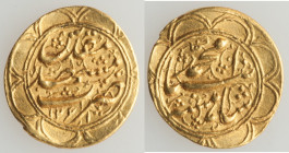Qajar. Muhammad Shah (AH 1250-1264 / AD 1834-1848) gold Toman AH 1261 (AD 1845/1846) XF, Mashhad mint, cf. KM853.6. 18.6mm. 3.46gm. Wavy flan. 

HID09...