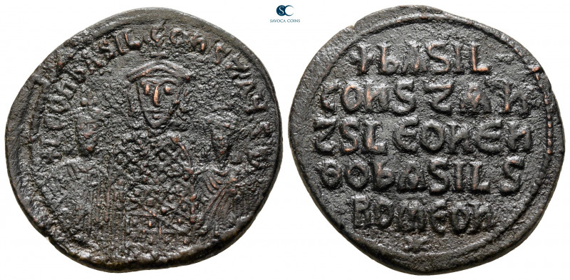 Basil I, with Leo VI and Constantine VII AD 867-886. Constantinople
Follis Æ
...