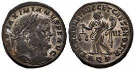 Maximianus. Follis. 303 AD. Aquileia. (Ric-VI 37b). (Paolucci-40). Anv.: IMP MAXIMIANVS P F AVG, laureate head right. Rev.: SACRA MONETA AVGG ET CAESS...