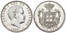 Portugal. D. Carlos I (1889-1908). 1000 reis. 1899. (Km-540). (Gomes-13.01). Ag. 24,86 g. It retains some minor luster. XF. Est...70,00. 

Spanish D...