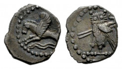 Phoenicia. Tyre. 1/16 shekel. 425-394 BC. (Rouvier 1819; Betlyon 20). (Hgc-10, 333). Anv.: Hippocamp left; two waves below. Rev.: Owl standing left, h...