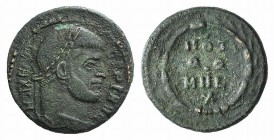 Maxentius (307-312). Æ Quarter Follis (16mm, 2.39g, 12h). Rome, 310-2. Laureate head r. R/ VOT/QQ/MVL/X within wreath. RIC VI 281a. Green patina, near...