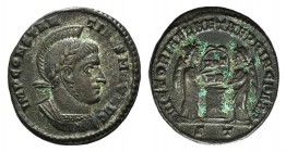 Constantine I (307/310-337). Æ Follis (17mm, 2.45g, 6h). Ticinum, 318-9. Laureate, helmeted and cuirassed bust r. R/ Two Victories standing vis à vis,...