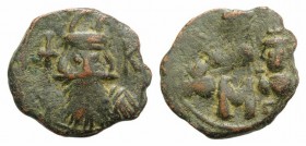 Constans II (641-668). Æ 40 Nummi (21mm, 4.04g, 6h). Constantinople, 666-668. Helmeted bust of Constans facing, holding globus cruciger; K to r. R/ La...