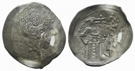 Manuel I Comnenus (1143-1180). Aspron Trachy (30mm, 2.68g, 6h). Constantinople, c. 1160-1164. Christ Pantokrator standing facing on low daïs. R/ Manue...