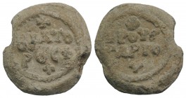 Byzantine Pb Seal, c. 7th-12th century (22mm, 10.89g, 12h). Legend in three lines; cross above. R/ Legend in two lines; cross above and below. Near VF