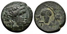 (Bronze.4.23g 18mm) Aeolis, Temnos .3rd century BC. 
Head of Dionysos right, wearing ivy wreath
Rev: Vine-branch with leaves and bunch of grapes; T-A ...