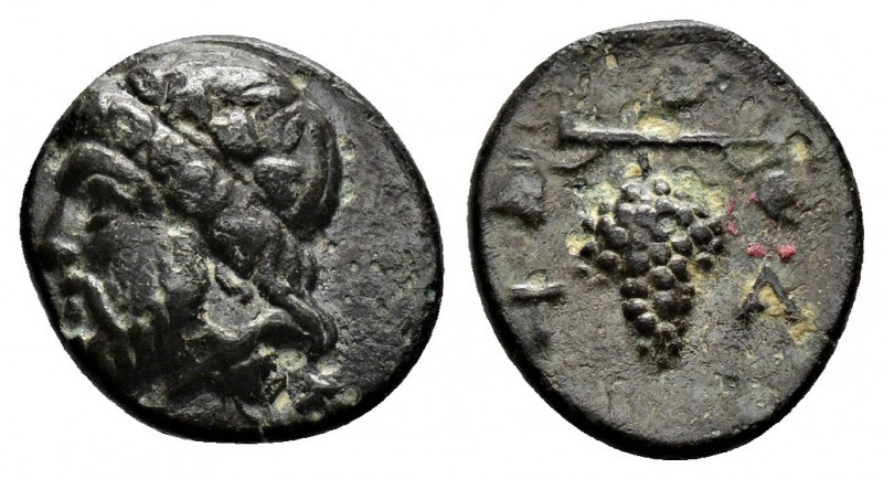 (Bronze.1.07g 12mm) AEOLIS. Temnos. Ae (3rd century BC).
Head of Dionysos left, ...
