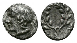 (Silver.0.22g 8mm) AEOLIS. Elaia. Obol (4th-3rd century BC). AR
Helmeted head of Athena left.
Rev: Wreath.
SNG München 383.
