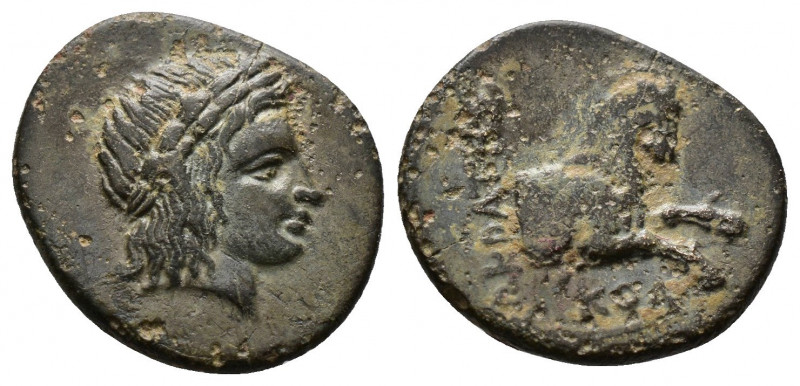 (Bronze.1.86g 16mm) IONIA. Kolophon. Ae (Circa 330-285 BC).
Laureate head of Apo...