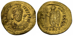 (Gold, 4.38gr 20mm) Anastasius I. (491-518 AD). AV Solidus Constantinople 
Helmeted and cuirassed bust facing slightly right, holding spear and shield...