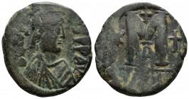 (Bronze, 17.29gr 30mm) Justin II , with Sophia (565-578 AD). AE Follis 
Justin, holding globus cruciger, and Sophia, holding cruciform scepter, seated...