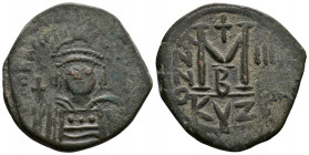 (Bronze, 12.38gr 31mm) Heraclius, 610-641. Follis 612-613, Cyzicus. 
Helmeted bust facing, holding globe cruciger and shield.
 Rev. Large M, cross abo...