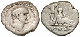 "Vespasian. A.D. 69-79. AR denarius (17.3 mm, 2.86 g, 6 h). Judaea Capta type. Rome mint, struck A.D. 69/70. IMP CAESAR VESPASIANVS AVG, laureate head...