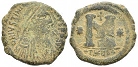 Justinian I. 527-565. Æ Follis (28mm, 14.8 g ). Theoupolis (Antioch) mint, 3rd officina. Struck 533-537. Pearl-diademed, draped, and cuirassed bust ri...