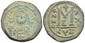 JUSTINIAN I (527-565). Follis. Kyzikos. (34mm, 19.4g )Obv: D N YSTINIANYS P P AVI. Helmeted and cuirassed bust facing, holding globus cruciger and shi...