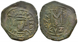 Heraclius. 610-641. Æ Follis (31mm, 9.8 g, ). Cyzicus mint, 2nd officina. Dated RY 2 (AD 611/2). Helmeted, diademed, and cuirassed facing bust, holdin...