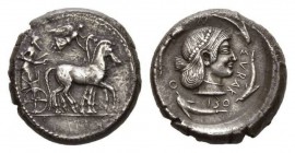 Sicily, Syracuse Tetradrachm circa 480-475, AR 25mm, 17.28 g. Slow quadriga driven right by charioteer holding reins with both hands; above, Nike flyi...