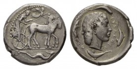 Sicily, Syracuse Tetradrachm circa 460-440, AR 27mm, 17.13 g. Slow quadriga driven r. by charioteer, holding kentron and reins; above, Nike flying r. ...