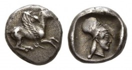 Corinthia, Corinth. Stater circa 510-500 AR 19mm, 8.47g Pegasos with curled wing, bridled, to right; below, Q. Rev. Head of Athena right, wearing neck...