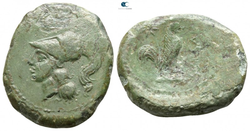 Campania. Suessa Aurunca 265-240 BC. 
Litra Æ

19mm., 5,43g.

Helmeted head...