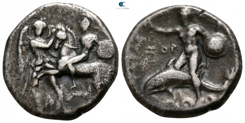Calabria. Tarentum circa 280 BC. 
Nomos AR

18mm., 7,40g.

Warrior, wearing...