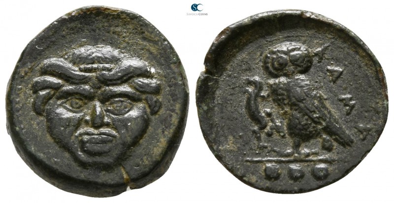 Sicily. Kamarina 420-405 BC. 
Tetras Æ

15mm., 3,23g.

Facing gorgoneion / ...