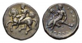 Calabria, Tarentum Nomos circa 344-340, AR 21.5mm, 7.83 g. Horseman galloping l., holding shield. Rev. Dolphin rider l. over waves, holding crested he...
