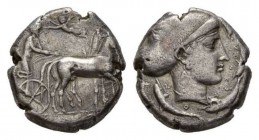 Sicily, Syracuse Tetradrachm circa 420, AR 23.5mm, 17.14 g. Slow quadriga driven r. by charioteer holding reins and kentron; in field above, Nike flyi...