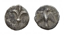Persian Period circa 380–332 BC Hemiobol, Judah, circa 332–302 BC, AR 8mm, 0.36 g. Lily. Rev. Falcon with spread wings looking r.; in r. field, YHD. T...