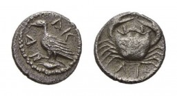 Sicily, Agrigentum Litra circa 450-440, AR 9mm., 0.53g. AK – RA partially retrograde Eagle, with closed wings, standing left on crab (?). Rev. Crab; b...