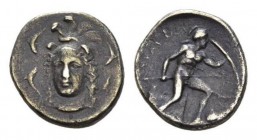 Sicily, Syracuse Drachm circa 405-395, AR 18mm., 3.97g. Helmeted head of Athena, facing three-quarters r.; around four dolphins. Rev. Leukaspis advanc...