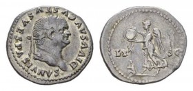 Divus Vespasianus. Denarius circa 80-81, AR 21mm., 3.32g. DIVVS AVGVSTVS VESPASIANVS Laureate head right. Rev. Victory alighting left placing shield o...
