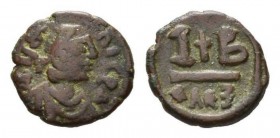Justinian I 527-565 527-565 12 Nummi 527-565, Æ 17.5mm., 3.87g. D N IVSTINI-ANVS P P AVG Laureate, draped and cuirassed bust right. Rev.I-B; in centre...