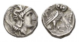 Calabria, Tarentum Drachm circa 302-280, AR 15mm., 3.28g. Head of Athena right; wearing Attic helmet decorated with Skylla. Rev. TAP Owl standing righ...