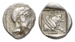 Lycia, uncertain mint Stater circa 440-410, AR 20mm., 8.51g. Helmeted head of Athena r. Rev. Kh – erê in Lycian characters Forepart of winged bull r.;...