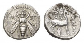 Phoenicia, Aradus Drachm circa 152-151, AR 18mm., 3.88g. Bee; to left, HϘ (date) and to right, monogram. Rev. APAΔIΩN Stag standing right; behind, pal...