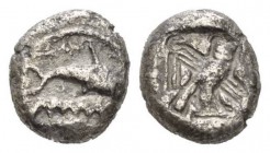 Phoenicia, Tyre Shekel circa 420-400, AR 19mm., 12.22g. Dolphin leaping r. over waves; below, murex shell. Rev. Owl of Egyptian type r., crowned with ...