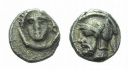Cilicia, Datames -Time of PharnabazosTarsus Obol 380-370, AR 8.5mm., 0.92g. Female head facing. Rev. Bearded warrior bust, wearing Athenian helmet. SN...