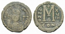 Justinian I, 527-565. 40 Nummi 544-545 (year 18), Æ 33mm., 19.87g. Helemetd and cuirassed facing bust. Rev. Large M, between A/N/N/O and X/V/III. Abov...