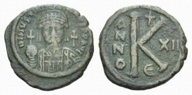 Justinian I, 527-565. 20 Nummi Constantinopolis 538-539 (year 12), Æ 30.5mm., 10.50g. Helmeted and cuirassed bust facing. Rev. Large K, between A/N/N/...