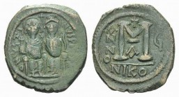 Justin II, 565-578. Follis Nicomedia 569-570, Æ 29.5mm., 14.58g. Justin on l. and Sophia on r., seated facing on double throne. Large M, between A/N/N...