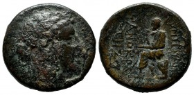Ionia, Smyrna. Circa 125-115 BC. Æ 20mm (21mm, 8.27g). Phanokrates, magistrate. Laureate head of Apollo right / The poet Homer seated left, holding sc...