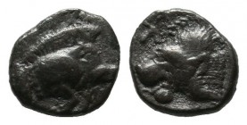 Mysia, Kyzikos. ca.450-400 BC. AR Tetartemorion (6mm, 0.22g). Forepart of boar right; tunny to left. / Head of roaring lion left; K to upper left; all...