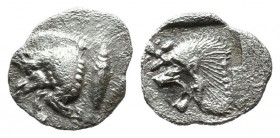 Mysia, Kyzikos. ca.525-475 BC. AR Tetartemorion (5mm, 0.25g). Forepart of boar right; tunny to left. / Head of roaring lion left; above floral star; a...