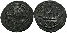 Justinian I. AD 527-565. Cyzicus. AE Follis (39mm, 22.56g). Helmeted, draped and cuirassed bust facing, holding globus cruciger and shield; cross in r...